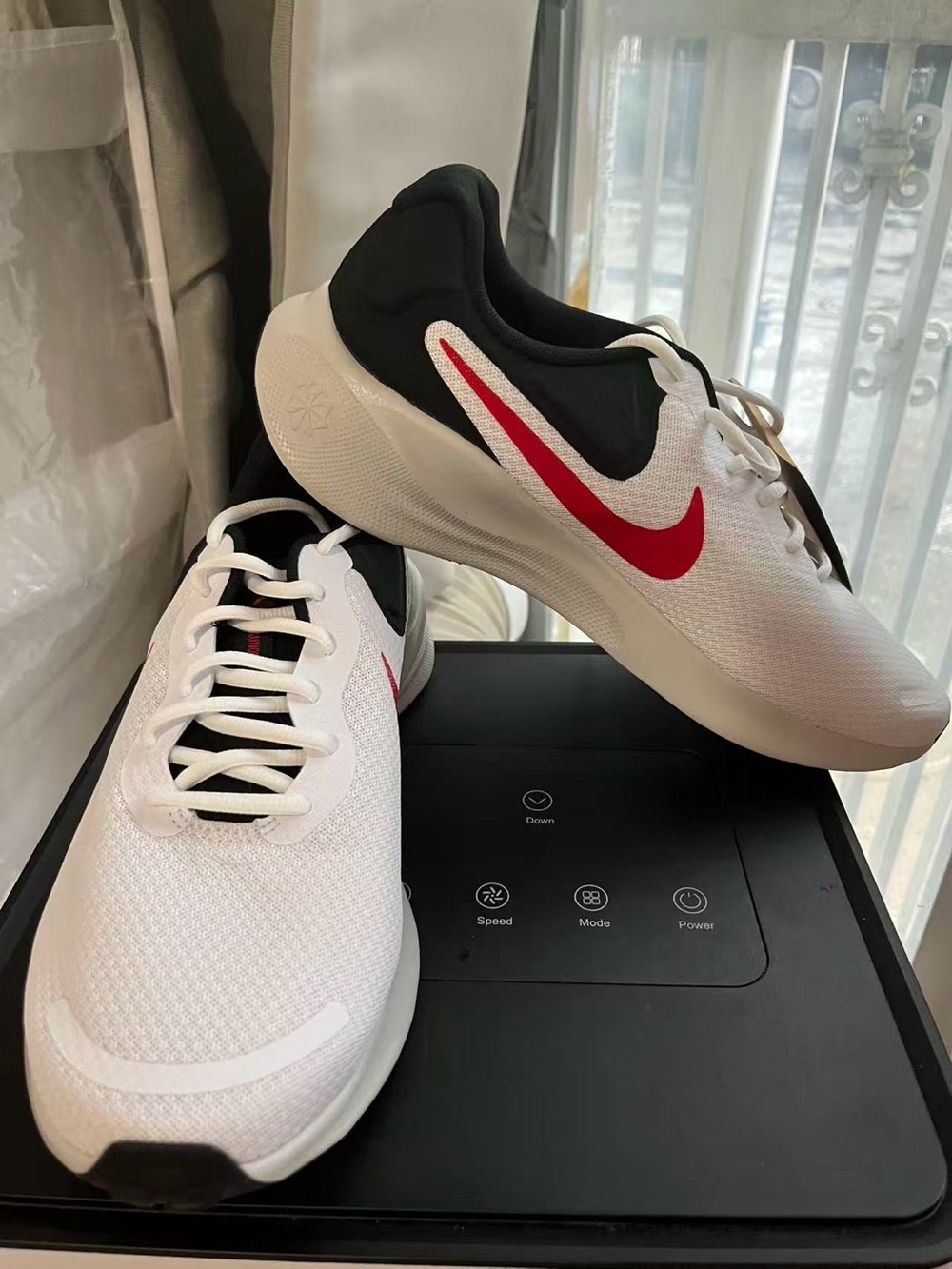 Nike Men’s White and Black Sneakers with Red Swoosh